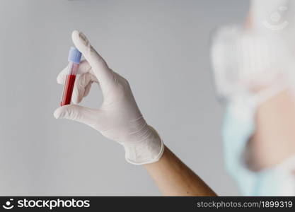 back view doctor holding blood sample. Resolution and high quality beautiful photo. back view doctor holding blood sample. High quality beautiful photo concept