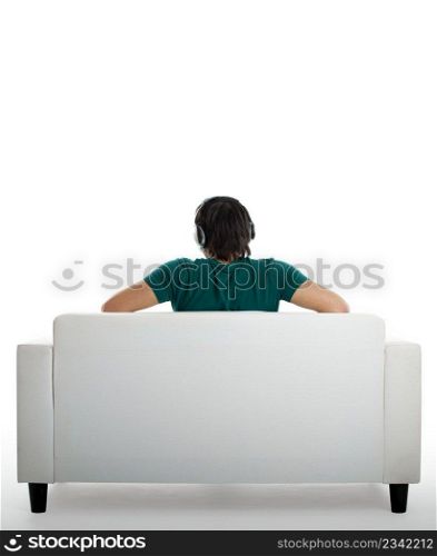 Back view from a young man seated on the couch 