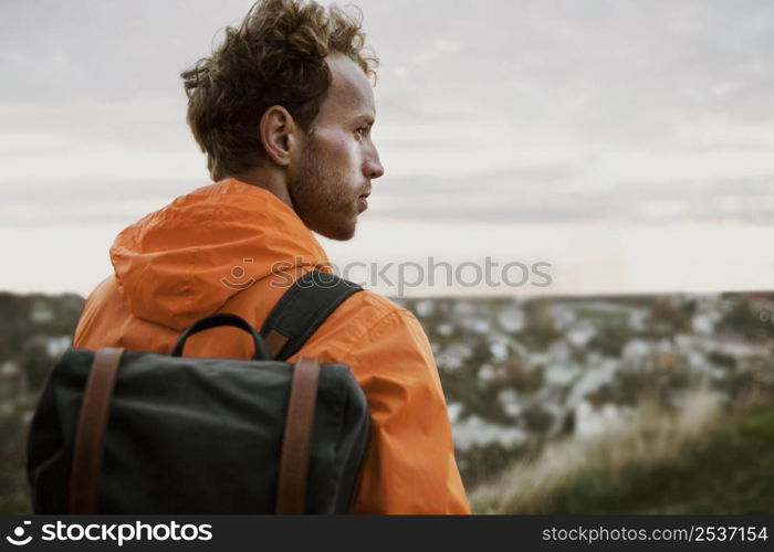 back view man admiring nature while road trip