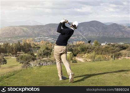 back view man playing golf field. Resolution and high quality beautiful photo. back view man playing golf field. High quality beautiful photo concept