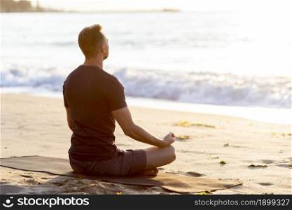 back view man relaxing beach outside. Resolution and high quality beautiful photo. back view man relaxing beach outside. High quality beautiful photo concept
