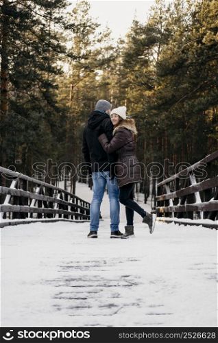 back view man woman outdoors together during winter