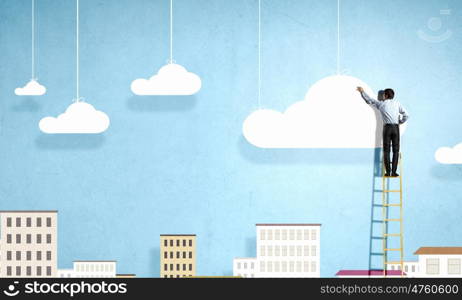 Back view of businessman standing on ladder and reaching to cloud. Computing concept