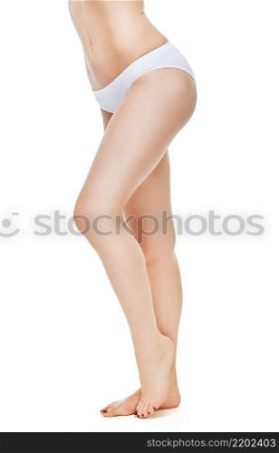 back view of female legs with white panties on white background. beautiful female legs with white panties on white background
