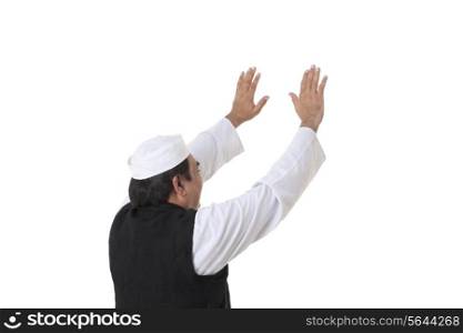 Back view of politician with raised hands
