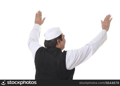 Back view of politician with raised hands