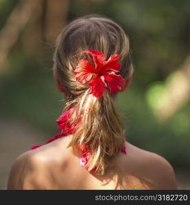 Back view of ponytail with a flower