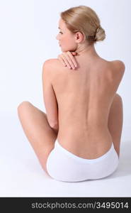 Back view of woman having backache