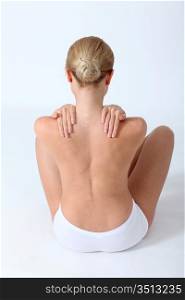 Back view of woman having backache