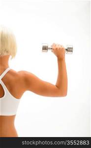 Back view portrait muscular blond woman holding dumbbell on white