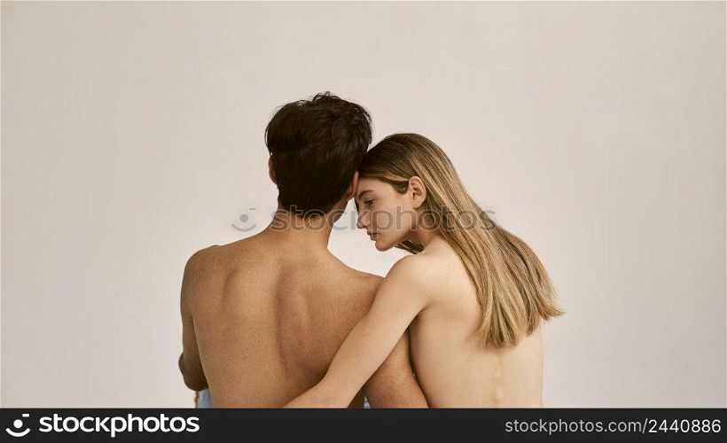 back view shirtless man woman embraced