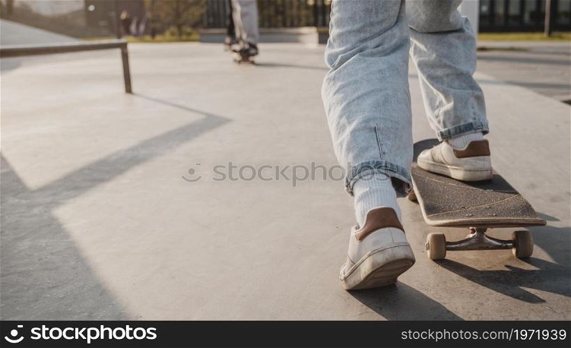 back view teenager with skateboard copy space skatepark. High resolution photo. back view teenager with skateboard copy space skatepark. High quality photo