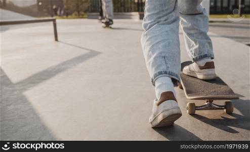 back view teenager with skateboard copy space skatepark. High resolution photo. back view teenager with skateboard copy space skatepark. High quality photo
