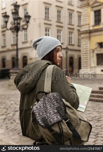 back view woman holding map