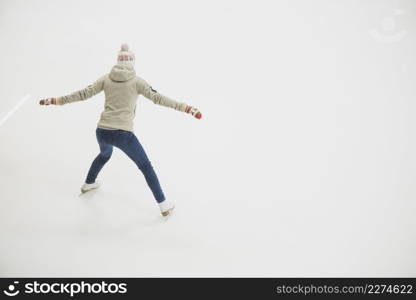 back view woman skating rink