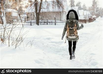 back view woman with backpack winter day 2
