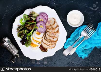 backed chicken fillet with white sauce on plate