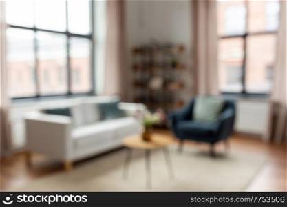 background and interior concept - blurred living room with furniture at home. blurred living room interior at home