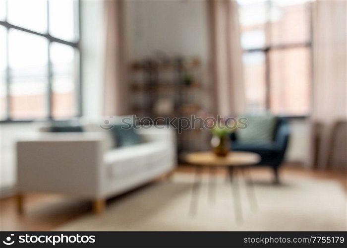background and interior concept - blurred living room with furniture at home. blurred living room interior at home