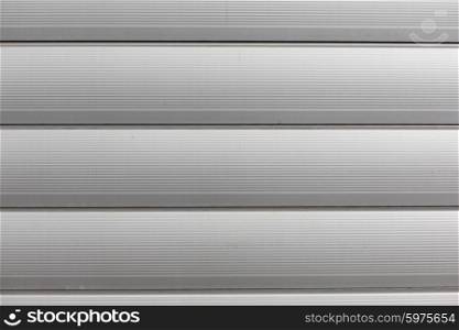 background and texture - close up of aluminum metal garage door backdrop. close up of aluminum metal garage door backdrop