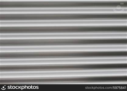 background and texture - close up of aluminum metal garage door backdrop. close up of aluminum metal garage door backdrop