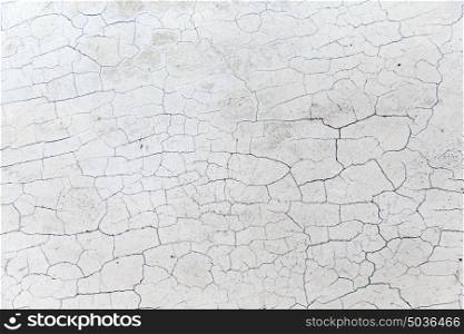 background and texture concept - close up of cracked stone wall or surface. close up of cracked stone wall or surface