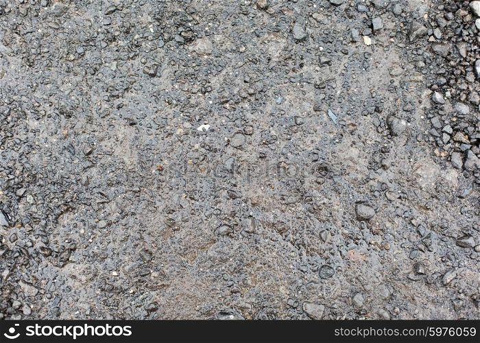 background and texture concept - close up of wet gray gravel road or ground. close up of wet gray gravel road or ground