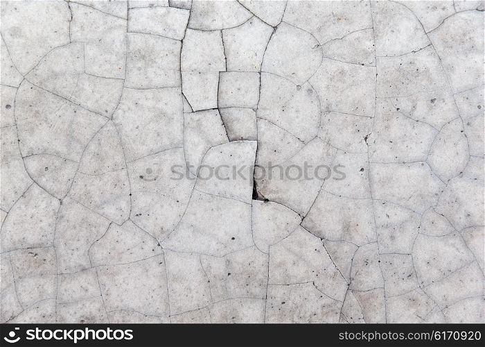 background and texture concept - cracked gray concrete wall. cracked gray concrete wall texture