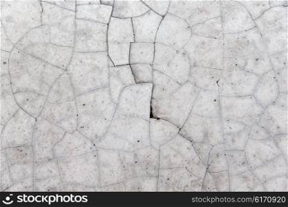 background and texture concept - cracked gray concrete wall. cracked gray concrete wall texture