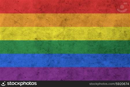 background and texture concept - gay rainbow flag on concrete wall surface. gay rainbow flag on concrete wall surface