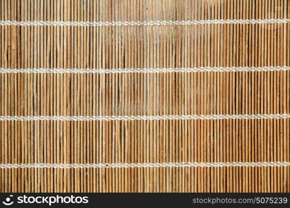 background and texture concept - natural bamboo mat or makisu. natural bamboo mat or makisu