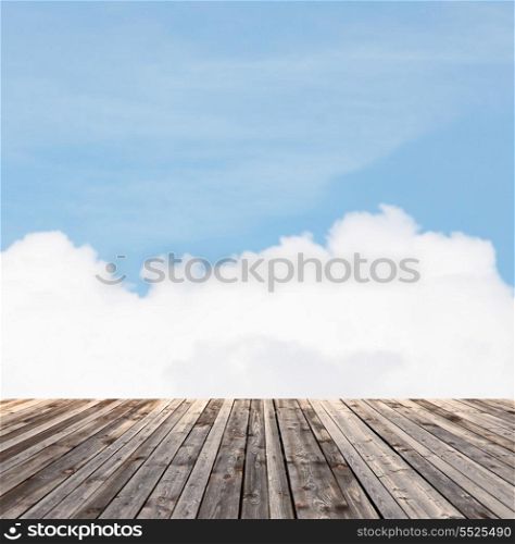 background and texture concept - wooden floor and blue sky