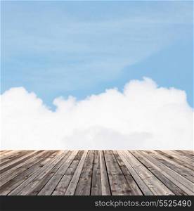background and texture concept - wooden floor and blue sky