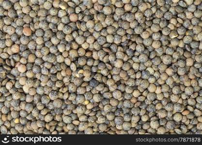 background and texture of dried French green lentils