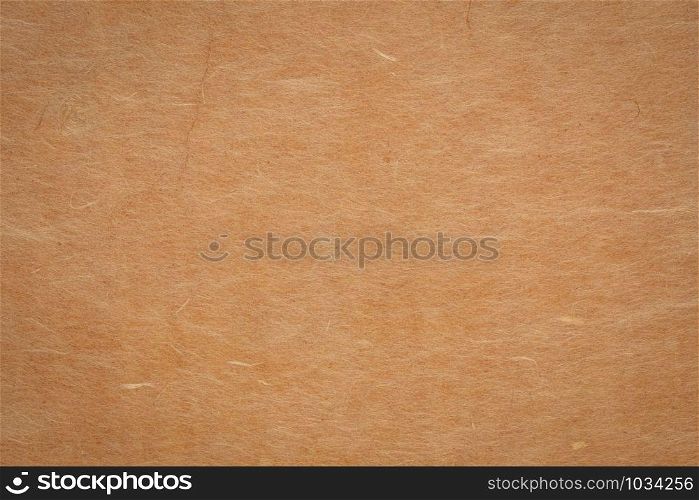 background and texture of ginger yellow Korean hanji paper handmade from inner bark of the mulberry tree