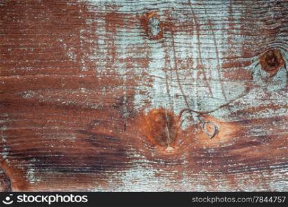 background and texture of grunge weathered barnwood with green paint remains