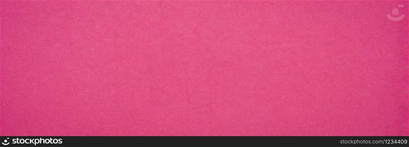 background and texture of hot pink handmade Indian paper created from recycled cotton fabric, panorama banner