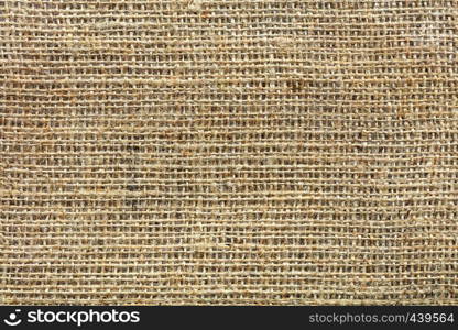 Background and texture of old burlap closeup. The background and texture of the weave of old burlap