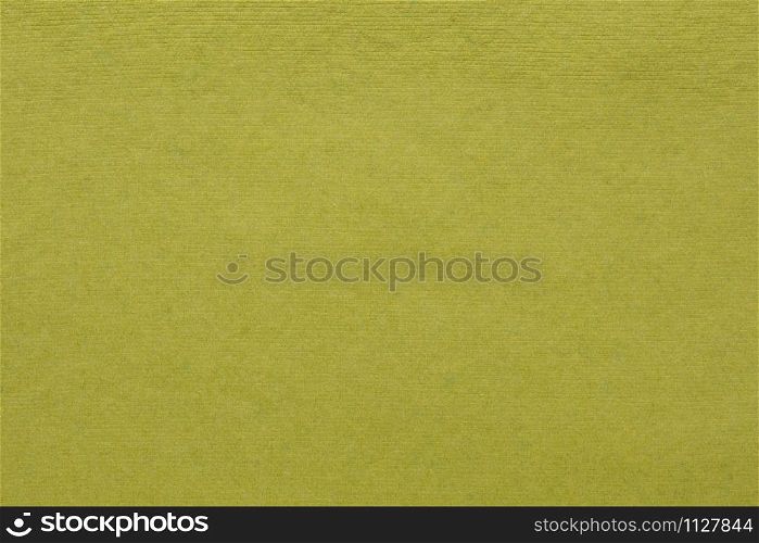 background and texture of olive green handmade Indian paper created from recycled cotton fabric
