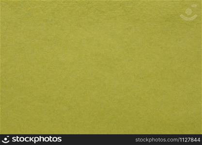 background and texture of olive green handmade Indian paper created from recycled cotton fabric