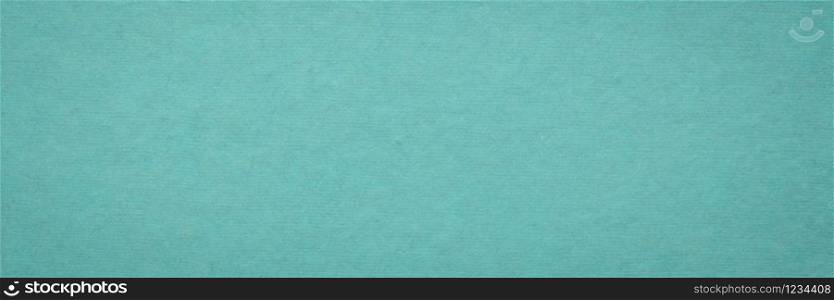 background and texture of teal blue handmade Indian paper created from recycled cotton fabric, panorama banner