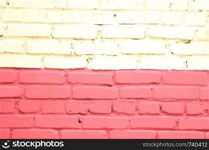 Background and texture painted yellow-red brick wall.