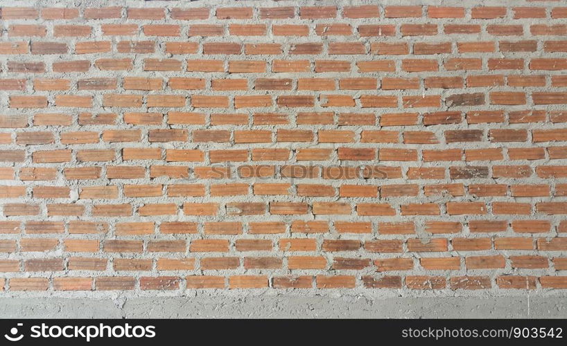 Background and texture vintage brick wall with mortar interior.