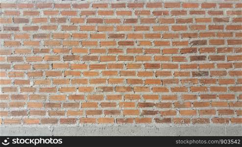 Background and texture vintage brick wall with mortar interior.