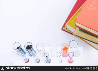 Background and top view of Science equipments, test tubes and books with copy space. Education Concept.