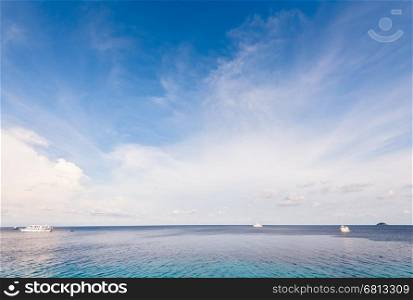 Background blue sky and cloud in summer over Andaman Sea at Honeymoon Bay in Mu Koh Similan island National Park, Phang Nga Province, Thailand