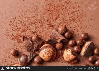 background delicious chocolate candy on a brown. delicious chocolate candies