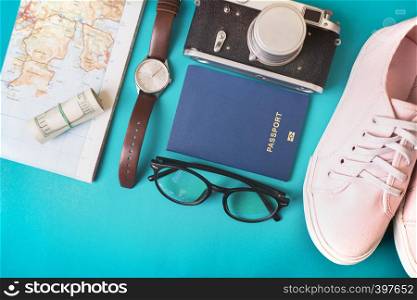 background for a trip - watches, sneakers, map, dollars, glasses, camera, passport