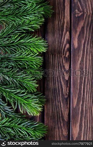 background from christmas tree on wooden background