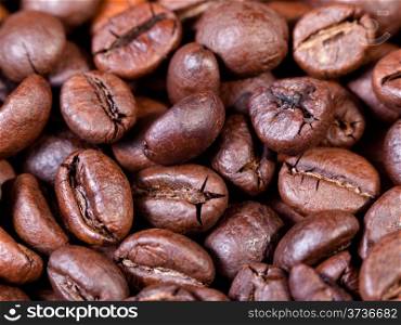 background from dark roasted coffee beans close up